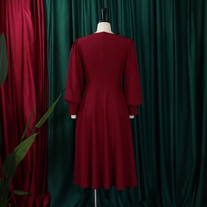 Back view of wine red A-line dress featuring elegant lantern sleeves and slim fit cut
