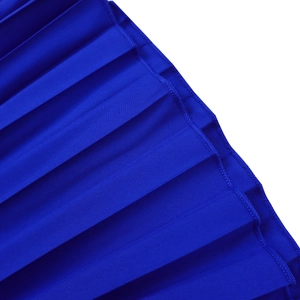 Macro detail of royal blue pleated fabric with high-precision heat-pressed folds and stitching