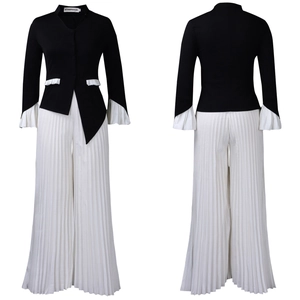 Detailed view of women's two-piece set featuring pleated flared sleeves and wide-leg trousers