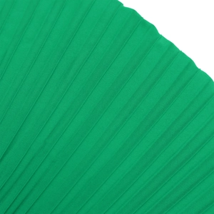 Detailed macro view of green pleated fabric texture with fine organza accordion folds