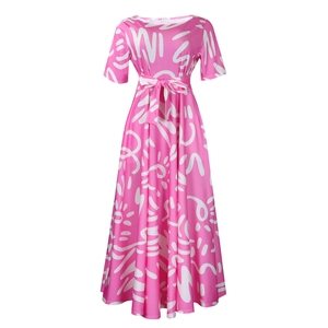 Detail of pink African print maxi dress with tie-waist and abstract white motifs