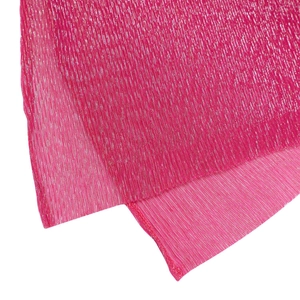 Close-up of hot pink fabric with sparkling metallic vertical glitter stripes