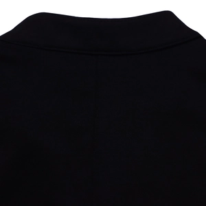 Detail of rear neckline and stitching on black bell-sleeve knit top for women