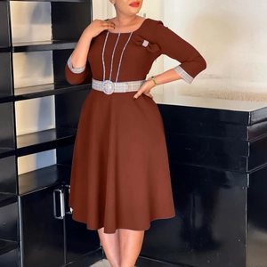 Detail view of the brown A-line dress with checkered belt and blue contrast piping