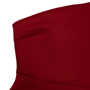 Detail of burgundy one-shoulder dress with smooth knit fabric and precise stitching