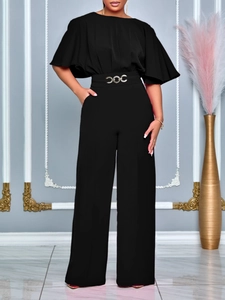 Elegant black wide leg jumpsuit with ruffle sleeves and a decorative gold waist buckle