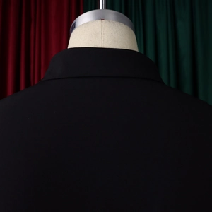 Close-up of a black blazer collar and back detail on a mannequin with metal neck support