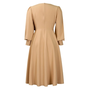 Detail view of back invisible zipper closure on long sleeve beige A-line dress
