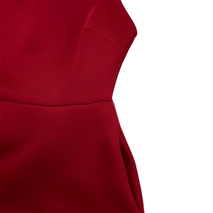 Close-up of the wine red dress featuring tailored waist seams and functional side pockets