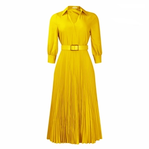 Detail of V-neck collar and waist belt with golden buckle on yellow pleated maxi dress
