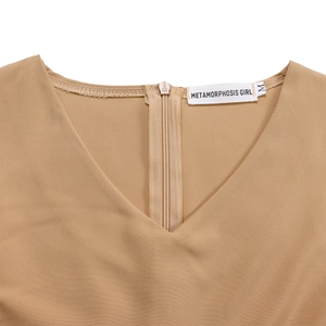 Detail of V-neckline and back zipper on solid khaki A-line dress with brand label