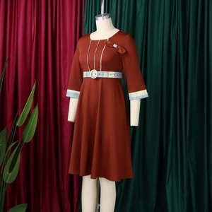 Detail of rust red African A-line dress with round neck and checkered pattern patchwork