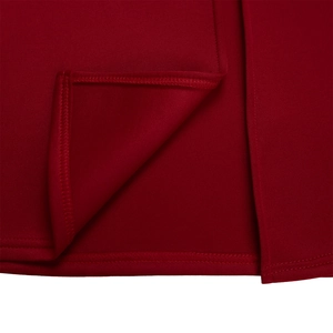 Close-up of the professional stitching and hem on a burgundy off-shoulder evening dress