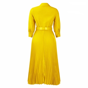 Detail view of the yellow pleated dress back featuring a classic collar and waist belt