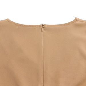 Macro shot of invisible zipper and stitching on khaki dress back collar detail