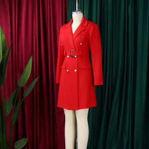 Detail of red double-breasted blazer dress with gold buttons and matching belt