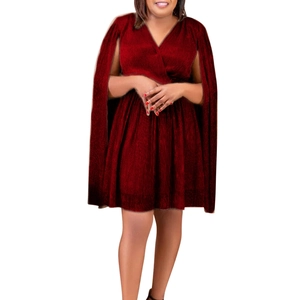 Detail of dark red V-neck mini dress featuring elegant cape sleeves and metallic fabric