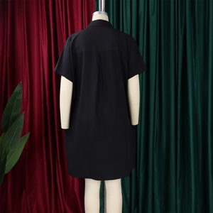 Rear view of black short sleeve midi shirt dress featuring back box pleat detail