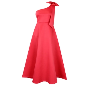 Detail of red one-shoulder dress showing oversized bow and elegant satin texture