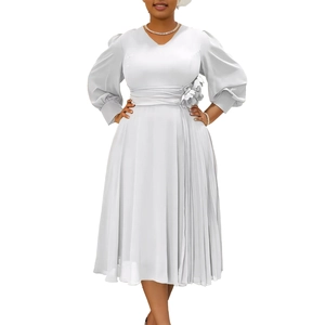 Detail of elegant V-neck dress featuring puffy long sleeves and floral waist decoration