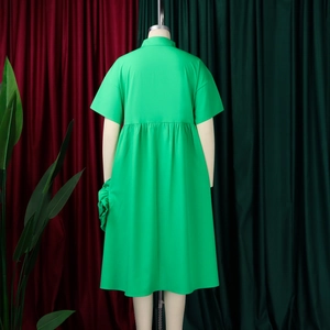 Rear view of vibrant green A-line shirt dress with pleated waist and side ruffle detail