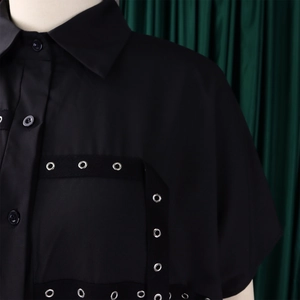 Detail of black shirt collar with industrial metal eyelets and fabric tape design