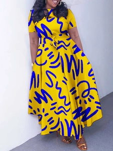 Elegant yellow African print maxi dress with blue abstract patterns and tie waist belt