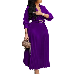 Detail of dark purple V-neck pleated maxi dress with waist belt and gold buckle accent