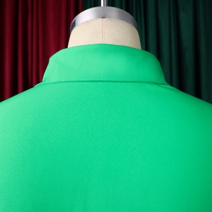 Detail view of the back collar and stitching on a lime green A-line shirt dress