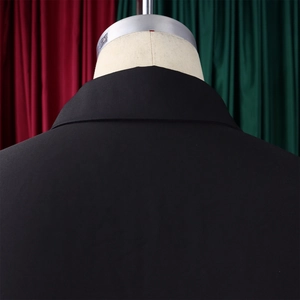 Detailed back view of the black lapel collar and woven texture on a shirt dress