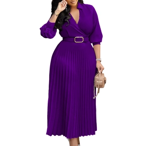 Detail view of deep purple pleated dress with V-neck, long sleeves and belted waistline