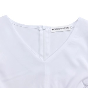 Detail view of white V-neck dress with hidden back zipper and high-quality stitching
