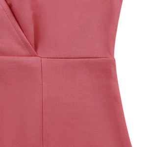 Macro detail of rose pink dress showing V-neckline stitching and fine fabric texture