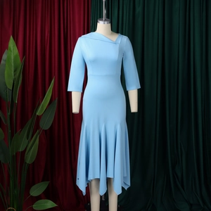 Detail view of the asymmetric neckline and irregular mermaid hem of the light blue dress