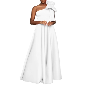 Detail of elegant white one-shoulder evening gown with large 3D bow and satin A-line skirt