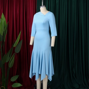 Detail of light blue dress with elegant shawl collar and asymmetric mermaid hemline