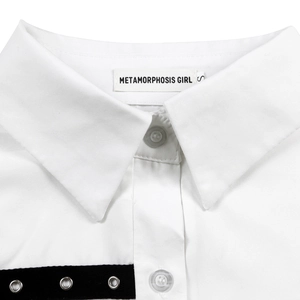 Detail of white shirt collar with sharp points, clear buttons, and black eyelet tape