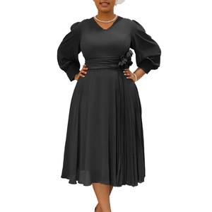 Detail of elegant V-neckline and 3D floral decoration on black pleated midi dress