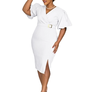 Detail of white V-neck dress featuring puff sleeves and a waist belt with golden buckle