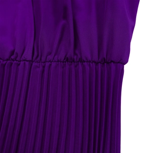 Detail of dark purple pleated dress showing elastic waist and fine accordion pleats
