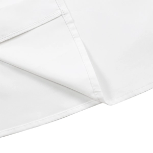Close-up of premium white shirt fabric featuring precise double stitching and neat seaming