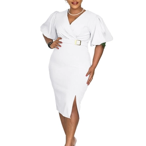 Detailed view of white V-neck dress with puff sleeves, waist belt, and side slit