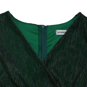 Close-up of elegant V-neck dark green dress fabric with subtle metallic vertical stripes