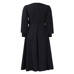 Back view detail of elegant black A-line dress with puff sleeves and invisible zipper