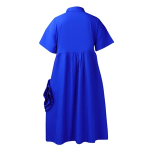 Back view of a royal blue short sleeve A-line dress with high waist and pleated details