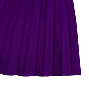 Close-up of deep purple pleated fabric with sharp vertical pleats and hem stitching details