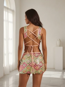 Women's backless sequin two-piece set with criss-cross top and mini skirt in pink and green