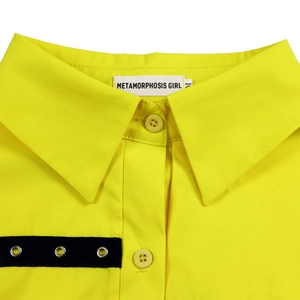 Close-up detail of yellow shirt collar with white woven brand label and metal eyelet tape