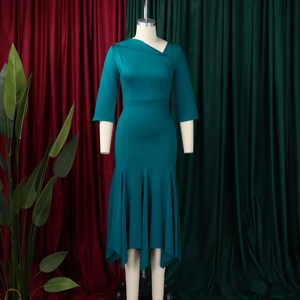 Detail of elegant asymmetric folded neckline and 3/4 sleeves on a teal midi dress