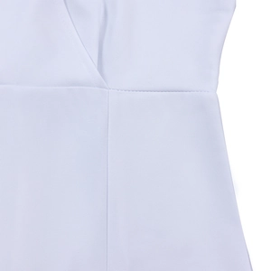 Close-up of the V-neck stitch and waistline seam on this white puff sleeve dress